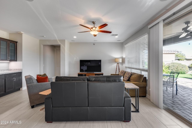 living room with ceiling fan