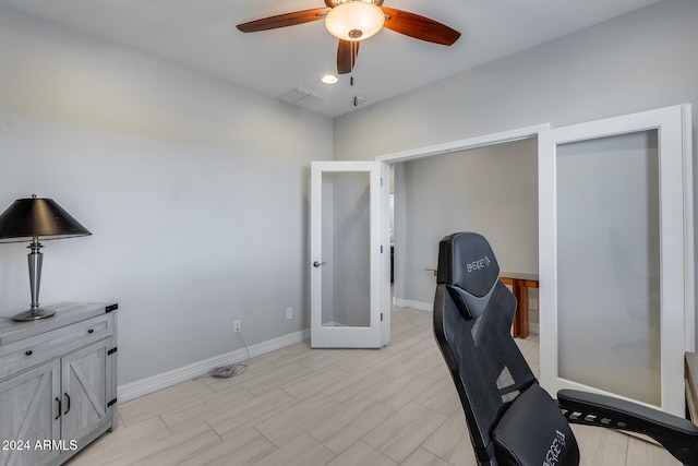 home office featuring ceiling fan and french doors