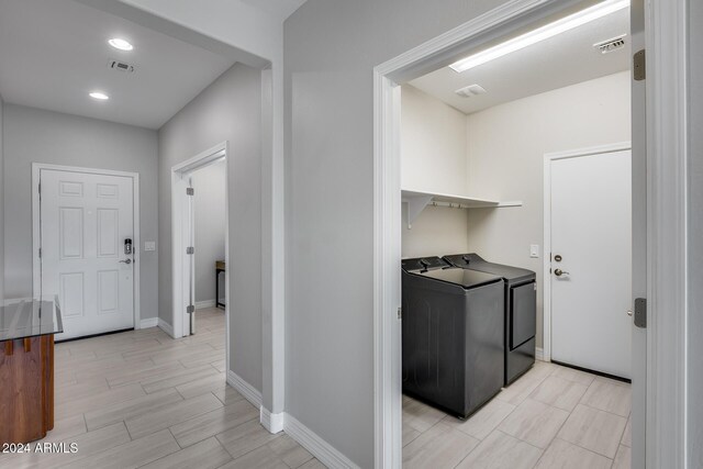 laundry room with washer and dryer