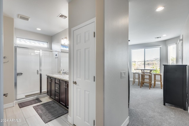 bathroom featuring vanity and walk in shower