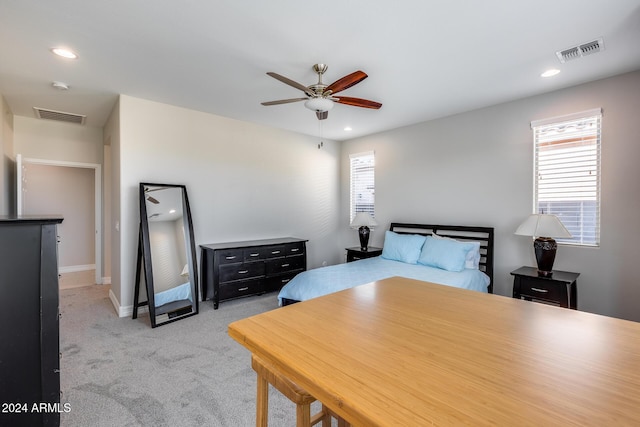 bedroom featuring ceiling fan and light carpet