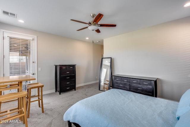 bedroom with ceiling fan and light colored carpet