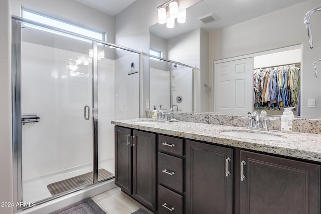 bathroom with vanity, tile patterned floors, and walk in shower