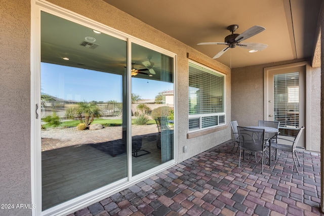 view of patio featuring ceiling fan