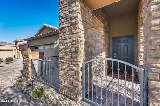 view of exterior entry featuring a garage