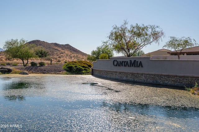 community sign featuring a mountain view