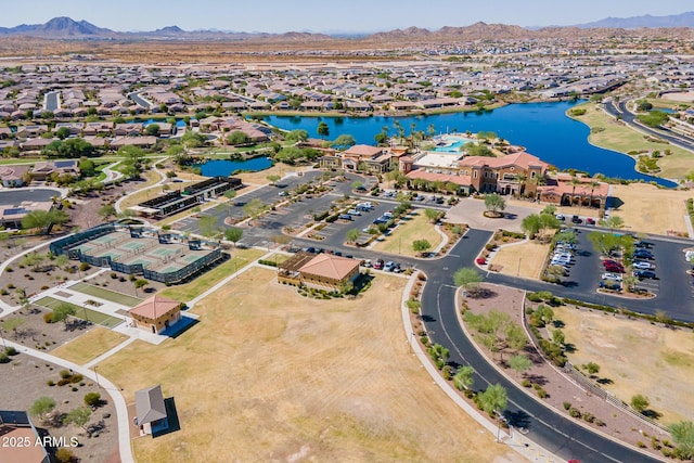 drone / aerial view with a water and mountain view