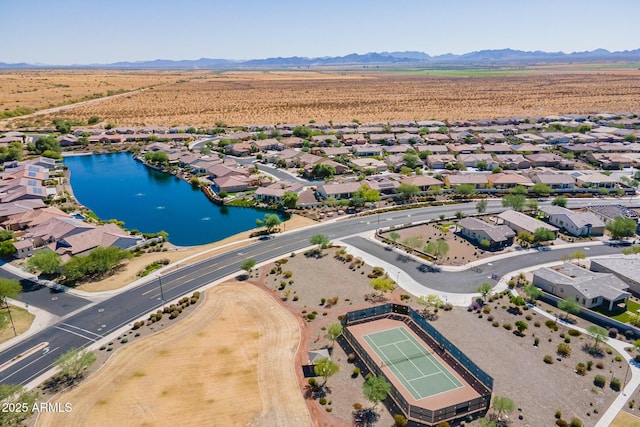 aerial view featuring a water and mountain view