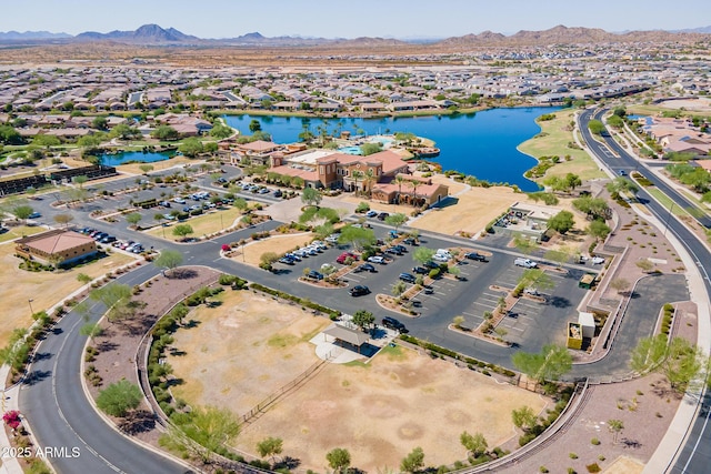 drone / aerial view with a water and mountain view