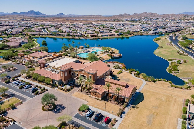 aerial view featuring a water and mountain view