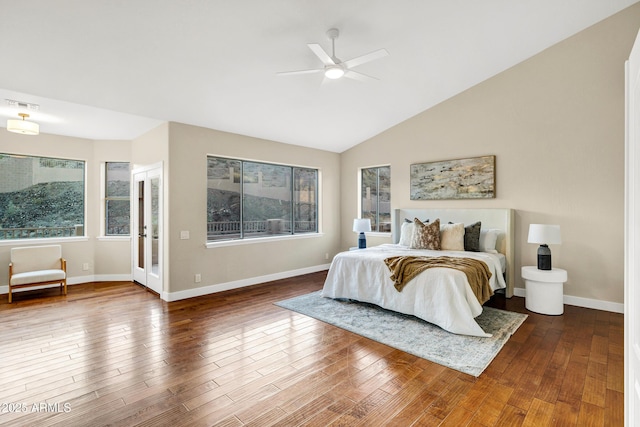 bedroom with baseboards, visible vents, and wood finished floors