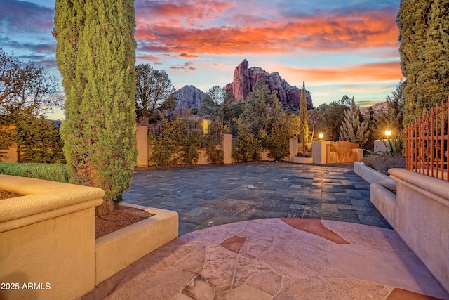 patio terrace at dusk with a mountain view