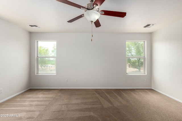 6637 W Watkins St, Phoenix, AZ 85043 - spare room with light carpet, baseboards, and ceiling fan
