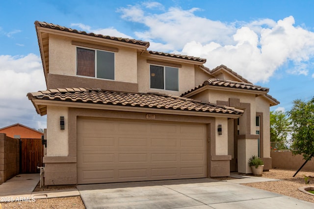 6637 W Watkins St, Phoenix, AZ 85043 - mediterranean / spanish-style house featuring concrete driveway, stucco siding, a garage, and a tiled roof