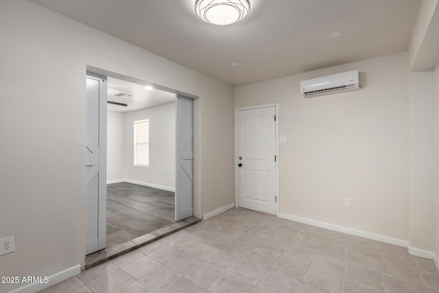 6637 W Watkins St, Phoenix, AZ 85043 - unfurnished bedroom with a wall mounted AC, baseboards, and light tile patterned floors