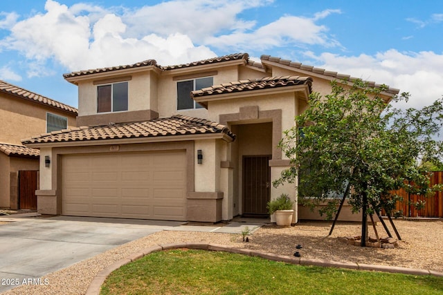 6637 W Watkins St, Phoenix, AZ 85043 - mediterranean / spanish home with concrete driveway, stucco siding, and a tile roof