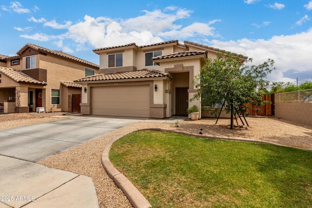 6637 W Watkins St, Phoenix, AZ 85043 - mediterranean / spanish house featuring driveway, stucco siding, an attached garage, and a tile roof