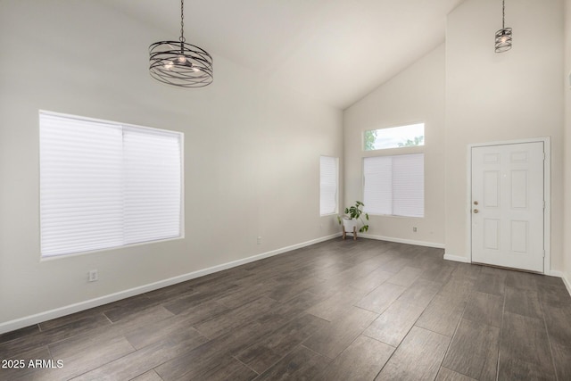 6637 W Watkins St, Phoenix, AZ 85043 - foyer with high vaulted ceiling, a chandelier, dark wood-style floors, and baseboards