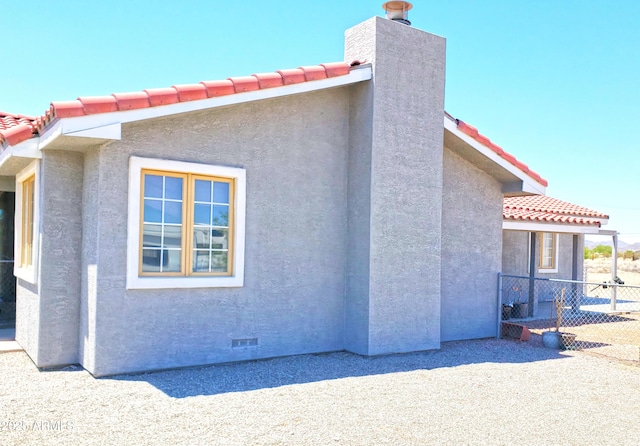 69762 Old Bell Rd, Salome, AZ 85348 - view of property exterior with stucco siding, a tiled roof, and crawl space