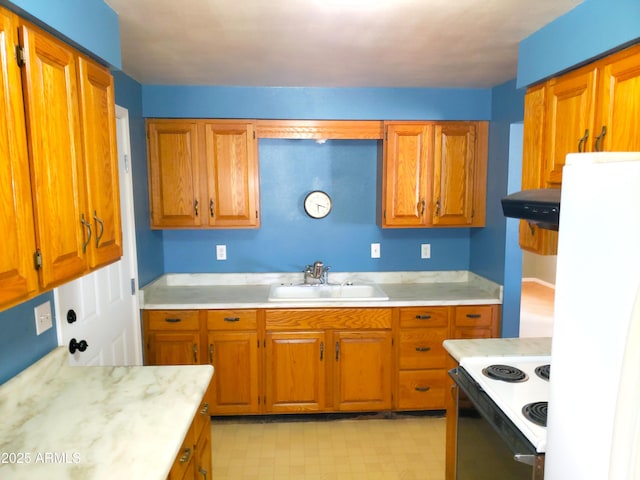 69762 Old Bell Rd, Salome, AZ 85348 - kitchen with range with electric stovetop, a sink, range hood, light countertops, and brown cabinets