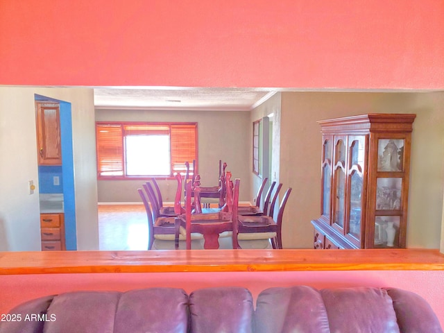 69762 Old Bell Rd, Salome, AZ 85348 - dining space featuring crown molding and baseboards