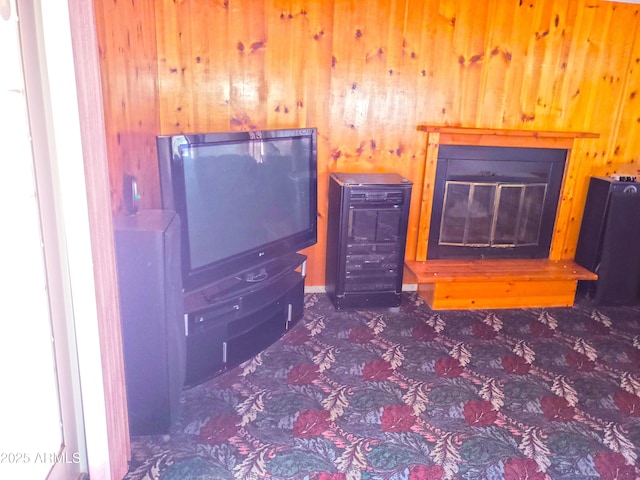 69762 Old Bell Rd, Salome, AZ 85348 - bedroom featuring wood walls, carpet floors, and a glass covered fireplace