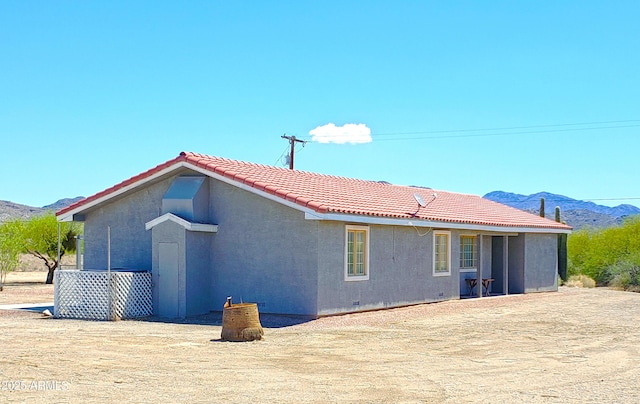 69762 Old Bell Rd, Salome, AZ 85348 - back of house with a tiled roof, stucco siding, and a mountain view