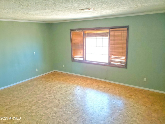 69762 Old Bell Rd, Salome, AZ 85348 - spare room featuring a textured ceiling, ornamental molding, and baseboards