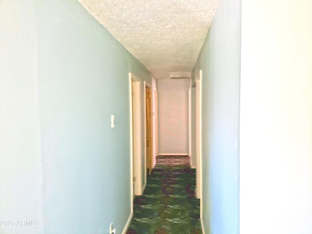 69762 Old Bell Rd, Salome, AZ 85348 - corridor featuring a textured ceiling and baseboards