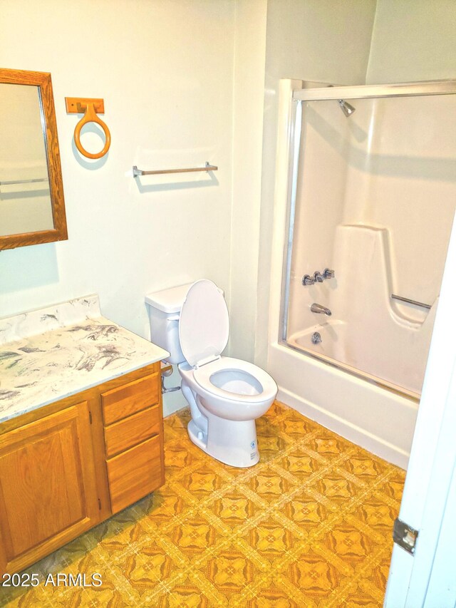 69762 Old Bell Rd, Salome, AZ 85348 - full bath featuring toilet, vanity, and bath / shower combo with glass door