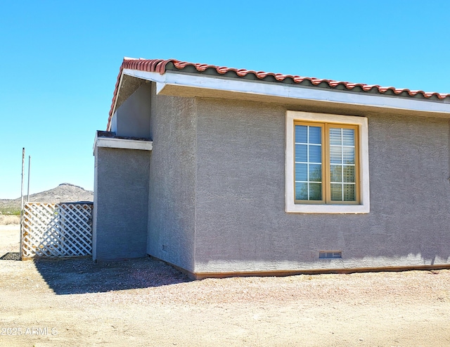 69762 Old Bell Rd, Salome, AZ 85348 - view of side of property featuring crawl space and stucco siding
