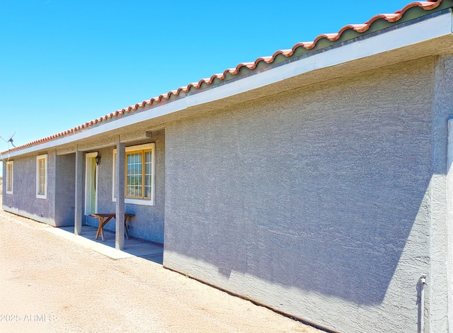 69762 Old Bell Rd, Salome, AZ 85348 - view of side of property featuring stucco siding and a tiled roof