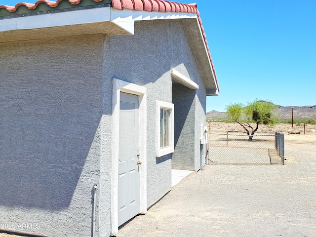 69762 Old Bell Rd, Salome, AZ 85348 - view of side of property with stucco siding and a tiled roof