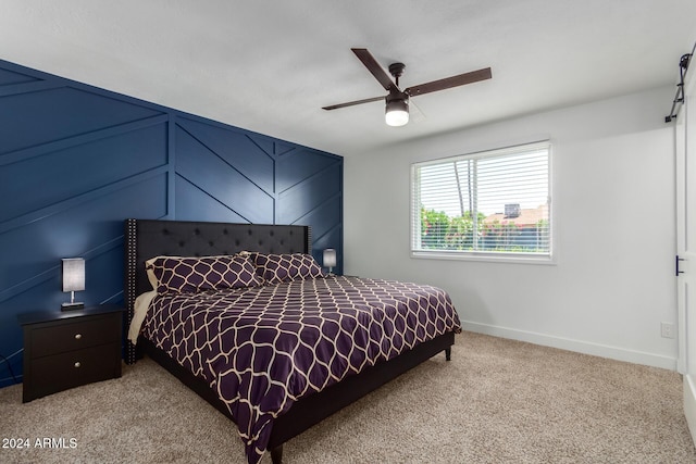 bedroom with light colored carpet, ceiling fan, and lofted ceiling