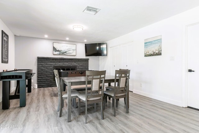 2041 E Harvard Dr, Tempe, AZ 85283 - dining room featuring light wood-style flooring, a fireplace, and recessed lighting