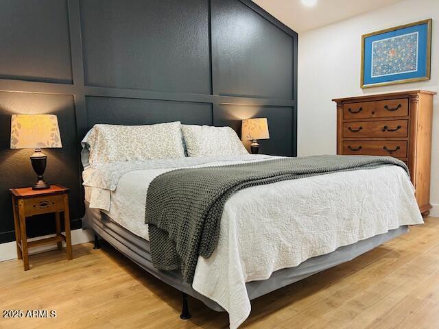 bedroom with light wood-style flooring