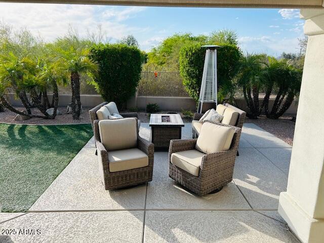 view of patio / terrace featuring an outdoor fire pit