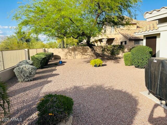 view of yard with fence
