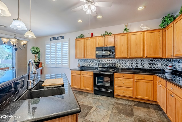 kitchen with hanging light fixtures, decorative backsplash, sink, and black appliances