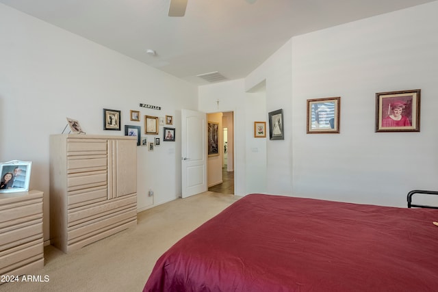 bedroom featuring ceiling fan and light carpet