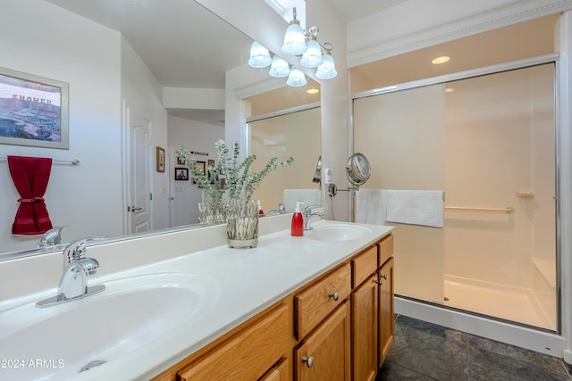 bathroom with vanity and a shower with shower door