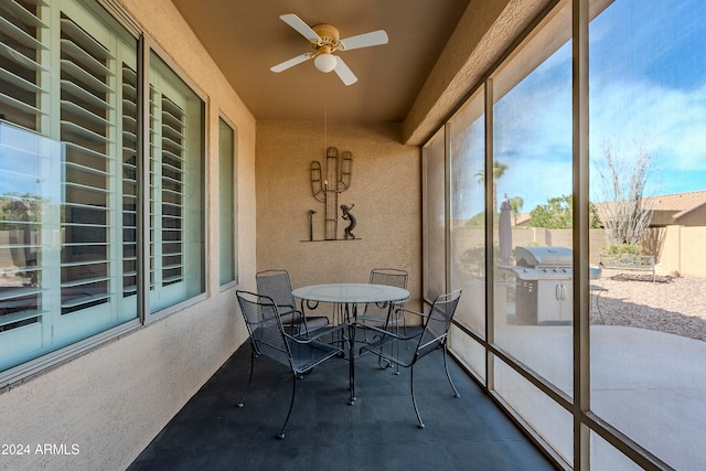 sunroom / solarium with ceiling fan and plenty of natural light