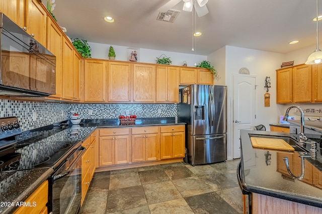 kitchen featuring black appliances, sink, hanging light fixtures, ceiling fan, and tasteful backsplash