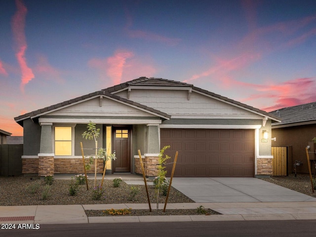 craftsman-style home with a garage