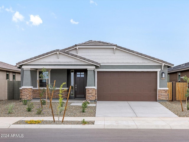 craftsman inspired home with a garage