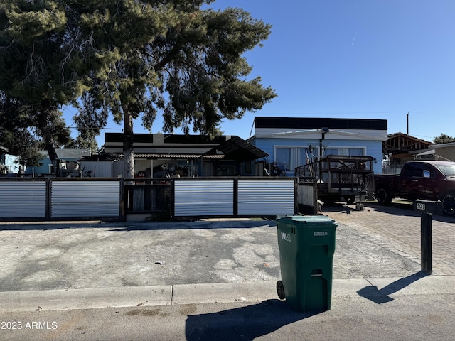 view of front of house featuring fence