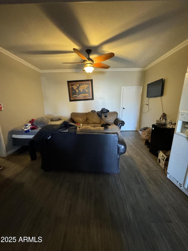 living room with dark wood-style floors, ceiling fan, and crown molding