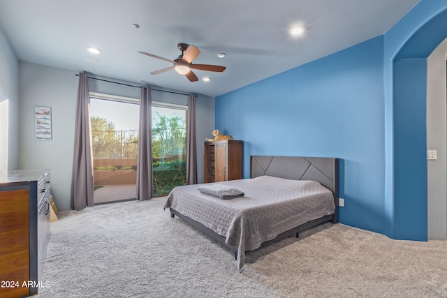 carpeted bedroom with ceiling fan and access to exterior