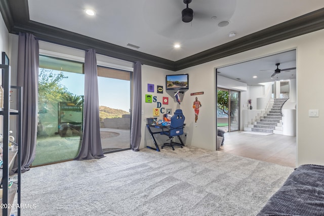 interior space with ceiling fan, hardwood / wood-style flooring, access to exterior, and crown molding