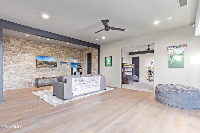 living room featuring light hardwood / wood-style floors and ceiling fan